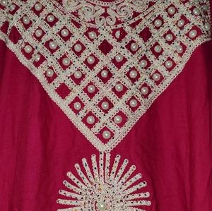 Morrocan kaftan.  Missing some beads